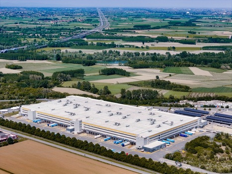 Torrazza Piemonte Italy 03 May 2026 Aerial view of the Amazon TRN1 fulfillment center with trucks at loading docks and surrounding green fields under a clear sky. Torrazza Piemonte Italy 03 May 2026 Aerial view of the Amazon TRN1 fulfillment center with trucks at loading docks and surrounding green fields under a clear sky.