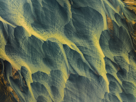 Aerial view of braided rivers carve paths through volcanic sands a mesmerizing tapestry of grey and gold Iceland. Aerial view of braided rivers carve paths through volcanic sands a mesmerizing tapestry of grey and gold Iceland.