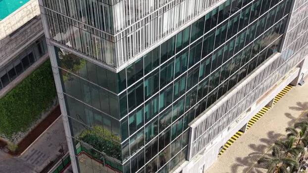 Aerial view of modern glass office building in India.