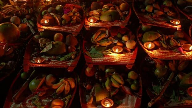 View of religious offerings with lit oil lamps at night Bangladesh. View of religious offerings with lit oil lamps at night Bangladesh.