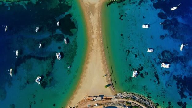 Aerial view of a sandbar with anchored boats in the Aegean Greece. Aerial view of a sandbar with anchored boats in the Aegean Greece.