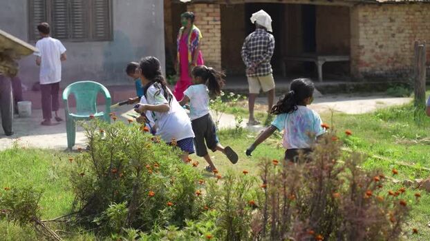 View of children playing with colored powder during Holi Nepal.