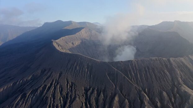 Aerial view of Mount Bromo crater with rising smoke Indonesia. Aerial view of Mount Bromo crater with rising smoke Indonesia.