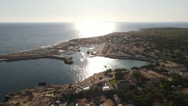 Aerial view of a coastal harbor and marina at sunset France. Aerial view of a coastal harbor and marina at sunset France.