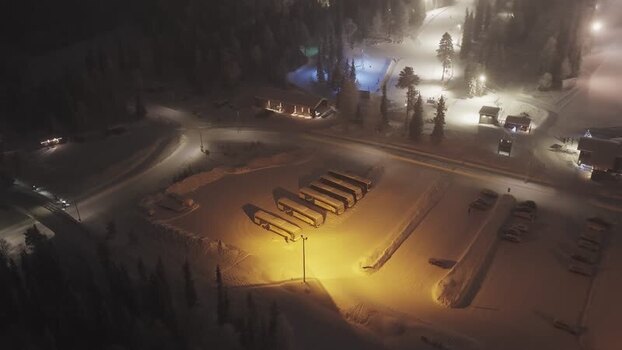 Aerial view of Luosto ski resort at night in Finland.