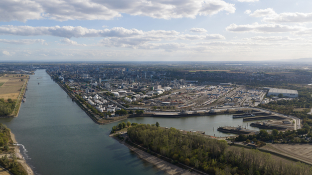 Aerial view of the BASF chemical plant complex situated along the Rhine river with industrial infrastructure storage tanks and warehouses in Ludwigshafen am Rhein Rheinland Pfalz Germany.