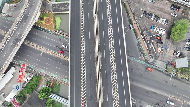 Aerial view of the elevated highway and intersection in Bekasi Barat West Java Indonesia. Aerial view of the elevated highway and intersection in Bekasi Barat West Java Indonesia.