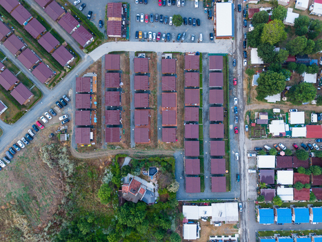 Aerial view of Arapya resort complex featuring rows of uniform bungalows parking areas and surrounding greenery in Burgas Bulgaria. Aerial view of Arapya resort complex featuring rows of uniform bungalows parking areas and surrounding greenery in Burgas Bulgaria.