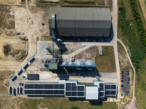 Aerial view of the Oat Milling Factory featuring large industrial warehouses storage silos and solar panel arrays on rooftops Kettering England United Kingdom. Aerial view of the Oat Milling Factory featuring large industrial warehouses storage silos and solar panel arrays on rooftops Kettering England United Kingdom.