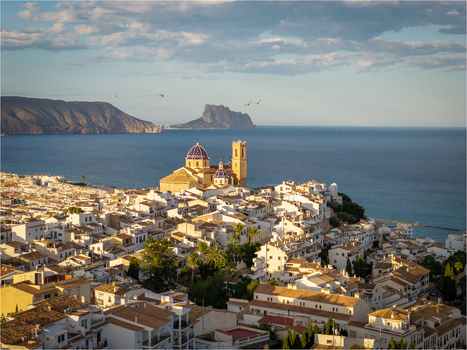Aerial view of the Church of Our Lady of Consolation with blue tiled domes overlooking the white washed old town and the Mediterranean Sea. Altea Valencian Community Spain.