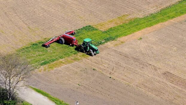 Aerial view of a tractor working in a field Czechia. Aerial view of a tractor working in a field Czechia.