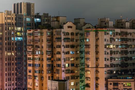View of illuminated high rise residential apartment buildings at night in a dense urban neighborhood in Sanchong District New Taipei City Taiwan. View of illuminated high rise residential apartment buildings at night in a dense urban neighborhood in Sanchong District New Taipei City Taiwan.