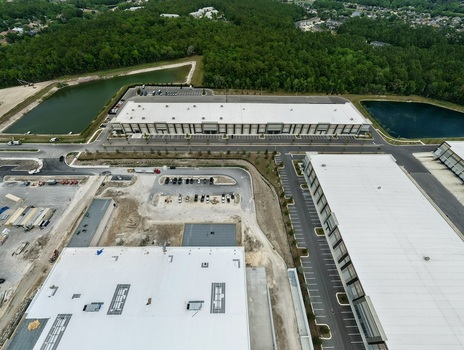 Aerial view of industrial warehouses and distribution centers near Saint Johns Parkway and International Golf Parkway at World Golf Village Florida United States. Aerial view of industrial warehouses and distribution centers near Saint Johns Parkway and International Golf Parkway at World Golf Village Florida United States.