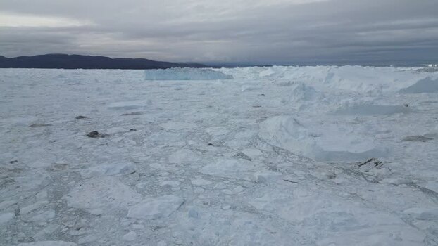 Aerial view of Ilulissat Icefjord with massive icebergs Greenland. Aerial view of Ilulissat Icefjord with massive icebergs Greenland.