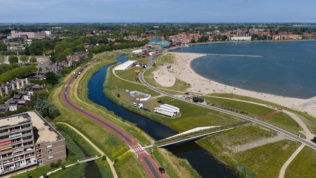 Hoorn Netherlands 20 June 2026 Aerial view of Stadsstrand Hoorn featuring a sandy beach along the Markermeer green embankments a canal and the urban cityscape under a clear blue sky. Hoorn Netherlands 20 June 2026 Aerial view of Stadsstrand Hoorn featuring a sandy beach along the Markermeer green embankments a canal and the urban cityscape under a clear blue sky.