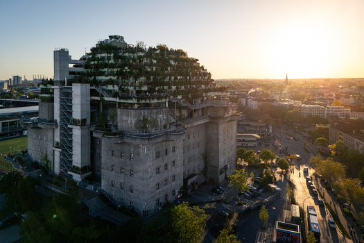 Hamburg Germany 01 May 2026 Aerial view of the St. Pauli Bunker featuring its lush rooftop garden and modern concrete architecture under a warm sunset glow. Hamburg Germany 01 May 2026 Aerial view of the St. Pauli Bunker featuring its lush rooftop garden and modern concrete architecture under a warm sunset glow.
