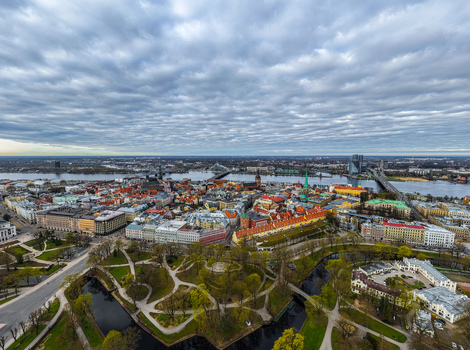 Aerial view of the historic Old Town of Riga featuring traditional rooftops the Daugava River and surrounding urban architecture in Riga Latvia. Aerial view of the historic Old Town of Riga featuring traditional rooftops the Daugava River and surrounding urban architecture in Riga Latvia.