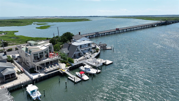 Aerial view of waterfront homes with private docks and boats on the bay near Stone Harbor beach in Stone Harbor New Jersey United States.