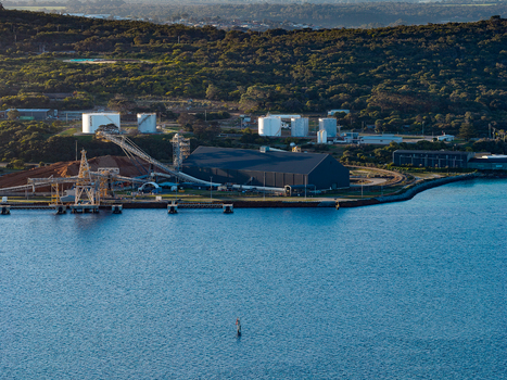 Aerial view of industrial port facilities and storage tanks near Camp Quaranup with dense coastal vegetation along the waterfront in Vancouver Peninsula Western Australia Australia. Aerial view of industrial port facilities and storage tanks near Camp Quaranup with dense coastal vegetation along the waterfront in Vancouver Peninsula Western Australia Australia.
