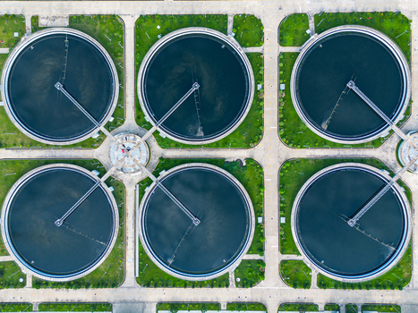 Aerial view of the circular clarifier tanks at the Sewage Treatment Plant Dhaka WASA surrounded by green lawns and concrete paths in Dhaka Dhaka Division Bangladesh. Aerial view of the circular clarifier tanks at the Sewage Treatment Plant Dhaka WASA surrounded by green lawns and concrete paths in Dhaka Dhaka Division Bangladesh.