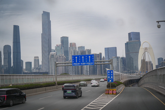 Guangzhou China 23 February 2024 View of the Guangzhou skyline featuring the Liede Bridge and modern skyscrapers under a cloudy sky. Guangzhou China 23 February 2024 View of the Guangzhou skyline featuring the Liede Bridge and modern skyscrapers under a cloudy sky.