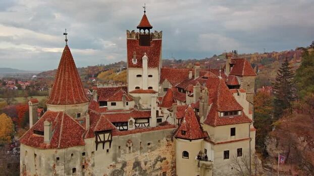 Aerial view of Bran Castle with red roofs in Bran Romania. Aerial view of Bran Castle with red roofs in Bran Romania.