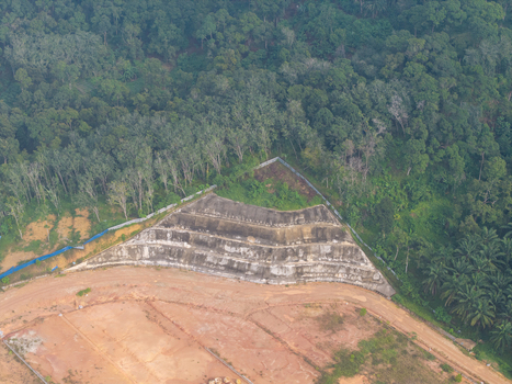 Aerial view of slope stabilization anchoring on a hillside with concrete retaining walls surrounded by dense forest and cleared land in Bukit Mertajam Penang Malaysia. Aerial view of slope stabilization anchoring on a hillside with concrete retaining walls surrounded by dense forest and cleared land in Bukit Mertajam Penang Malaysia.