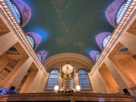 View of the iconic brass clock and celestial ceiling in the Main Concourse of Grand Central Terminal New York New York United States. View of the iconic brass clock and celestial ceiling in the Main Concourse of Grand Central Terminal New York New York United States.