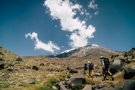 Turkey 14 August 2023 View of Mount Ararat with a group of hikers trekking up the rocky volcanic mountain slope under a clear blue sky. Turkey 14 August 2023 View of Mount Ararat with a group of hikers trekking up the rocky volcanic mountain slope under a clear blue sky.