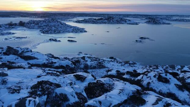 Aerial view of snowy islands in water Sweden.