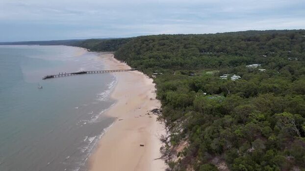 Aerial view of Kingfisher Bay Resort and the pier on K gari Australia. Aerial view of Kingfisher Bay Resort and the pier on K gari Australia.