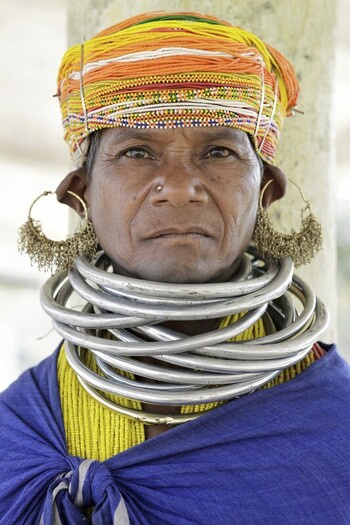 Odisha India 26 March 2026 View of a tribal woman adorned with traditional metal jewelry her weathered face framed by vibrant headdress and striking silver neck rings. Odisha India 26 March 2026 View of a tribal woman adorned with traditional metal jewelry her weathered face framed by vibrant headdress and striking silver neck rings.