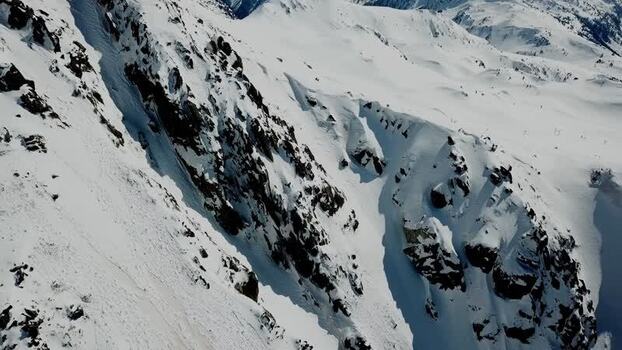 Aerial view of snowy mountain slopes in Baqueira Spain.