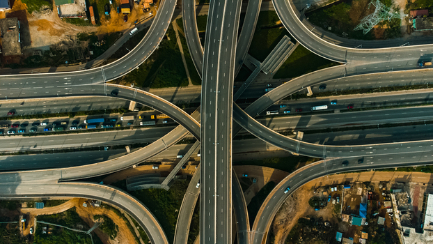 Aerial view of the Pokuase Interchange with multi level flyovers flowing traffic and surrounding urban landscape in Ga North Municipal Greater Accra Region Ghana. Aerial view of the Pokuase Interchange with multi level flyovers flowing traffic and surrounding urban landscape in Ga North Municipal Greater Accra Region Ghana.