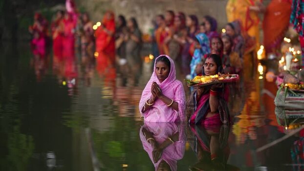 View of Hindu women performing religious rituals in a river Bangladesh. View of Hindu women performing religious rituals in a river Bangladesh.