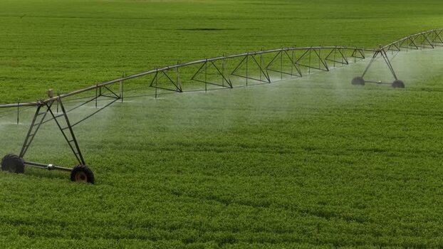 Aerial view of an irrigation system over green fields Portugal.