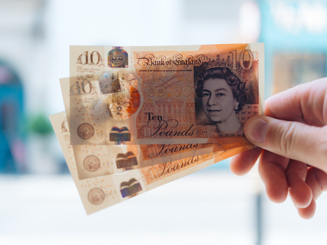 London United Kingdom 20 June 2025 View of crisp ten pound notes held aloft their vibrant hues contrasting against a soft blurred backdrop. London United Kingdom 20 June 2025 View of crisp ten pound notes held aloft their vibrant hues contrasting against a soft blurred backdrop.
