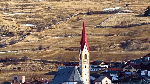 Aerial view of Nauders church in the Tyrolean Alps Austria.