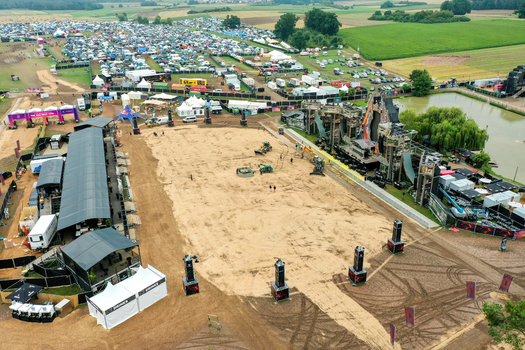Herzogenaurach Germany 27 July 2025 Aerial view of the Open Beatz Festival site featuring large stages tents and a sandy central area surrounded by green fields. Herzogenaurach Germany 27 July 2025 Aerial view of the Open Beatz Festival site featuring large stages tents and a sandy central area surrounded by green fields.