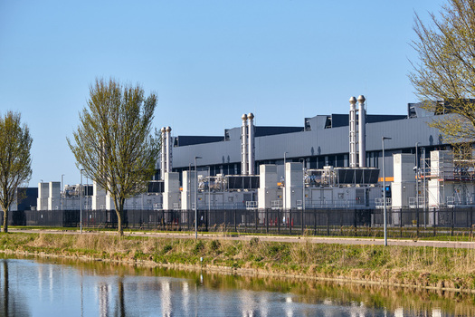 Middenmeer Netherlands 14 April 2026 View of the Microsoft datacenter AMS13 with cooling systems and industrial stacks under a clear blue sky. Middenmeer Netherlands 14 April 2026 View of the Microsoft datacenter AMS13 with cooling systems and industrial stacks under a clear blue sky.
