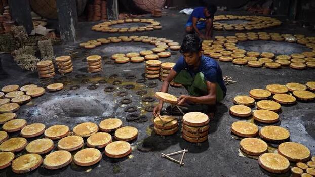 View of workers arranging traditional food in Bogura Bangladesh. View of workers arranging traditional food in Bogura Bangladesh.