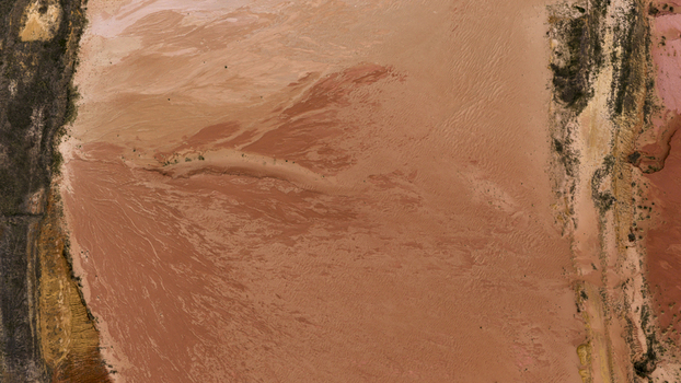 Aerial view of salt production ponds and sand formations showing vibrant pink yellow and earthy textures in the landscape Kalbarri Western Australia Australia. Aerial view of salt production ponds and sand formations showing vibrant pink yellow and earthy textures in the landscape Kalbarri Western Australia Australia.