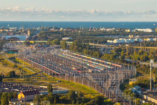 Gdansk Poland 23 September 2026 Aerial view of the extensive railway marshalling yard with numerous freight tracks colorful cargo containers and industrial infrastructure. Gdansk Poland 23 September 2026 Aerial view of the extensive railway marshalling yard with numerous freight tracks colorful cargo containers and industrial infrastructure.