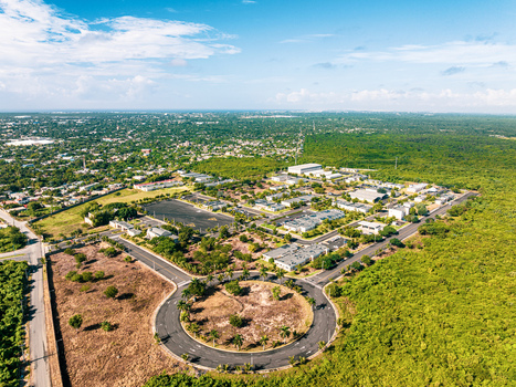 Aerial view of Base de Infanteria de Marina Valm. Manuel Ramon Montes Arache A.R.D. with military buildings a roundabout and greenery in Boca Chica Santo Domingo Dominican Republic. Aerial view of Base de Infanteria de Marina Valm. Manuel Ramon Montes Arache A.R.D. with military buildings a roundabout and greenery in Boca Chica Santo Domingo Dominican Republic.