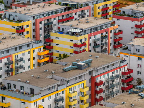 Aerial view of modern residential apartment buildings with vibrant yellow and red balconies in the city of Brno South Moravian Region Czechia.