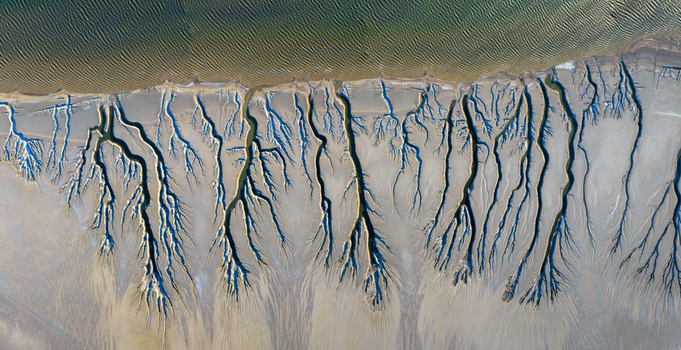Aerial view of the intricate dendritic drainage patterns of the Reserva de la Biosfera Alto Golfo de California y Delta del Rio Colorado Tijuana Baja California Mexico. Aerial view of the intricate dendritic drainage patterns of the Reserva de la Biosfera Alto Golfo de California y Delta del Rio Colorado Tijuana Baja California Mexico.