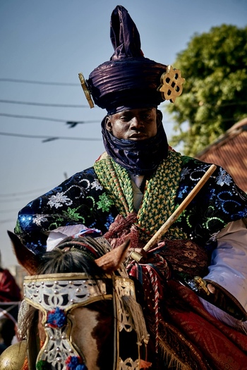 Zaria City Nigeria 21 March 2026 View of a regal figure in an elaborate robe and towering turban riding a richly adorned horse. Zaria City Nigeria 21 March 2026 View of a regal figure in an elaborate robe and towering turban riding a richly adorned horse.