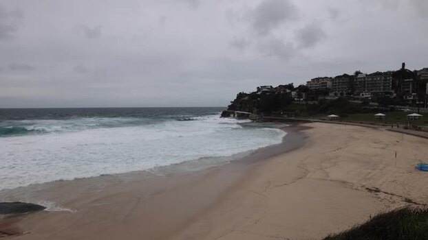 View of Bondi Beach with crashing waves in Sydney Australia.