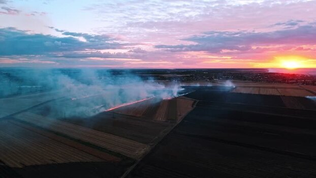 Aerial view of field fire at sunset near Sremska Mitrovica Serbia. Aerial view of field fire at sunset near Sremska Mitrovica Serbia.