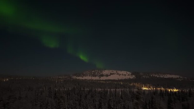 Aerial view of Aurora Borealis over Luosto hill Finland.